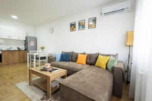 a living room with a couch and a table at Dana in Požarevac