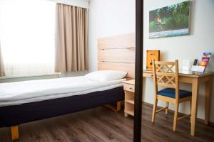 Postel nebo postele na pokoji v ubytování Finlandia Hotel Airport Oulu