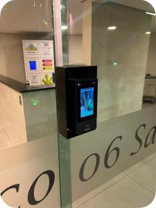 a display in a store with a tv on a counter at Comfortable Apartment Near Alphaville in Jandira