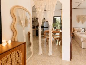 a living room with a mirror and a table at Amsterdam House - Hin Kong - Double King Bed - 4K SmartTV in Wok Tum