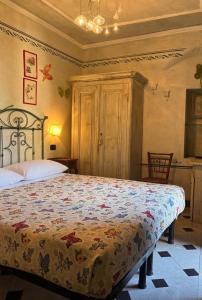 a bedroom with a large bed in a room at La Rocca Sospesa - Castello in Apricale