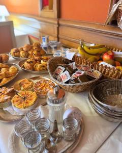 a table topped with lots of different types of food at Hôtel Restaurant Chez Henriette in Phalsbourg