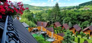 an aerial view of a house with a yard at Zielone Wzgórza - Centrum Soliny - SPA 695-744-679 in Solina +60 photos