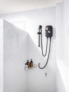 a shower in a white tiled bathroom with a phone at Boho House - 2mn Srithanu - King Bed - 4K SmartTV in Hinkong +37 photos