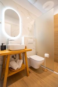 a bathroom with a sink and a toilet at Anemi Residence in Chios