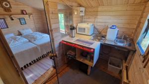 an overhead view of a small kitchen in a tiny house at Paradise cottage w sea view in Brännöviken 5, Lögdeå in Lögdeå