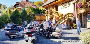 a group of motorcycles parked outside of a building at Zielone Wzgórza - Centrum Soliny - SPA 695-744-679 in Solina