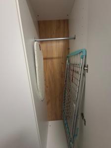 a walk in closet with a door and a shelf at Costa Royal Resort in Villajoyosa +8 photos