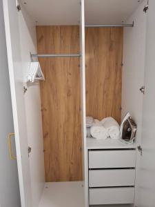 a walk in closet with a wooden door at Costa Royal Resort in Villajoyosa