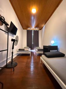 a room with two beds and a lamp in it at Lisboa Parque Guest House in Lisbon +76 photos