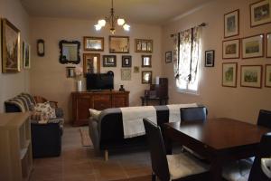 a living room with a couch and a table at Casa Nicolás in Portomarin