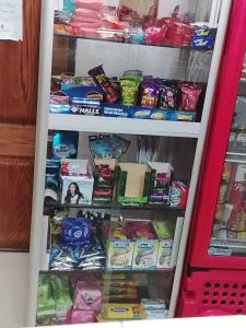 a refrigerator filled with lots of different types of food at Hotel Oriente Real in Rionegro