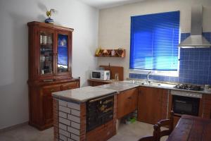 a kitchen with a sink and a counter top at Casa Nicolás in Portomarin +14 photos