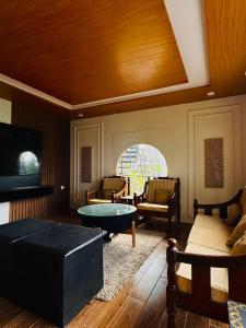 a living room with a couch and a table at The Margallia in Islamabad