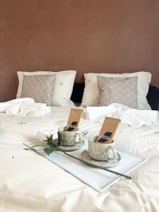 a bed with two books on top of it at Brightside Suite in Kristiansand