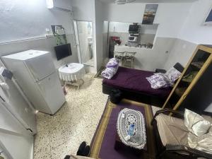 an aerial view of a living room with a bed at Bizerte Tunisia cozy studio in Bizerte