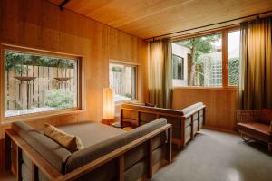 a bedroom with two beds and two windows at Arx Boutiquehotel in Schladming +59 photos