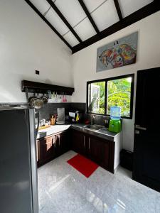 a kitchen with a sink and a window at Sunbeam Villa in Tangalle