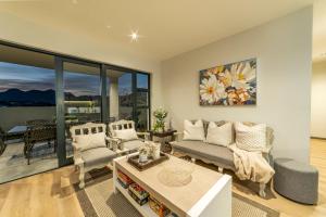 a living room with a couch and a table at Fifty Ridge in George