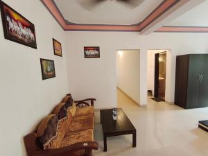 a living room with a couch and a table at Studio by Jackfruit in Arambol