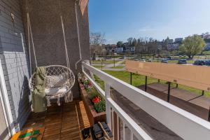 a porch swing with a view of a park at Apartman Nika-Self check-in,Free Parking in Vukovar