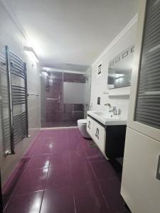 a bathroom with a shower and a toilet and a sink at New Halat, Linda in Jbeil +14 photos