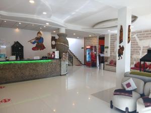 a lobby of a store with a bar in the middle at Hotel Cristales De Sal in Uyuni
