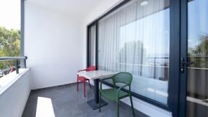 a balcony with a table and two chairs at Kıyı Hotel Restaurant in Gebze +2 photos