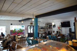 a restaurant with tables and people sitting at tables at Tortugas Brews B&B in Bocas Town