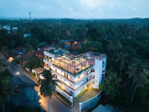 an overhead view of a building with lights on at Luminara Sky Lounge with Pool near Ahangama Beach in Ahangama