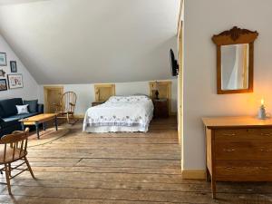 a bedroom with a bed and a living room at Seaside Beach Resort in Saint Andrews