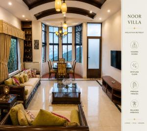 a living room with a couch and a tv at Luxury Noor Villa in Khaira Gali