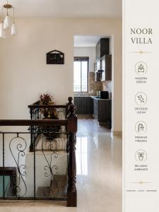 a view of a living room and kitchen with a table at Luxury Noor Villa in Khaira Gali