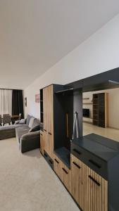 a living room with a couch and a table at Old Beach Apartments 2 in Vlorë +20 photos
