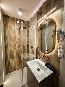 a bathroom with a sink and a shower at Pod Kolumnami in Pilica +58 photos