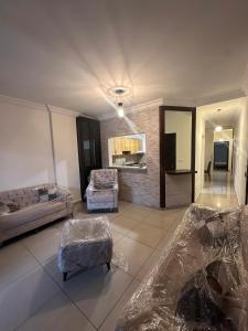 a large living room with a bed and a couch at Berbara, Chadi in Dayr Jannīn