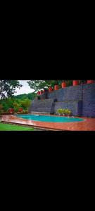 a view of a swimming pool in a park at LODHA VINTAGE Atdc in Kolvan +2 photos