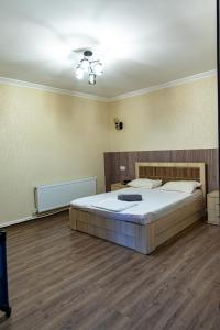 a bedroom with a large bed in a room at Spitak tun in Ijevan