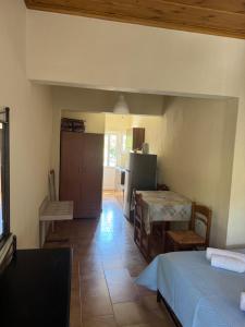 a room with a kitchen and a dining room at PERDIKI STUDIOS in Kokkino Nero