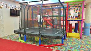 a person is playing on a ride in a playground at Zefir SPA in Polańczyk