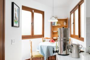 a kitchen with a table and a blender on a counter at Alpujarra Relax with Terrace in Órgiva