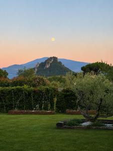 a view of a mountain with the moon in the sky at Ophidia in Foix