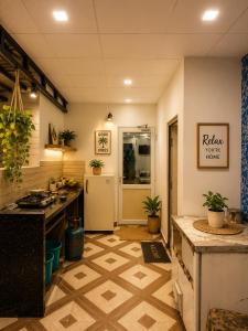 a kitchen with a sink and a refrigerator at Aanadam Resort in Jaipur +2 photos