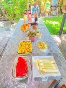 a table with a bunch of food on it at Cabana Jamelão in Camaçari