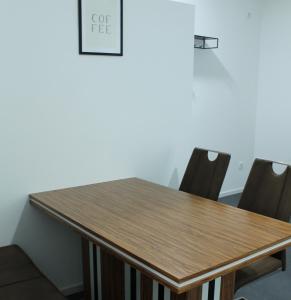 a table in an office with chairs around it at Royal Racing Suite Top 3 near Red Bull Ring in Judenburg