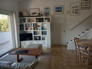 a living room with a couch and a table at Les mimosas in Collioure