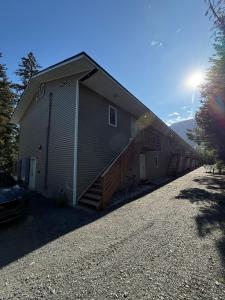 a building with a staircase on the side of it at Pond Studio Apartments in Seward
