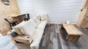 a living room with a white couch and a coffee table at cozy corner in Dalton