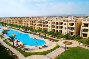 an aerial view of a resort with a large swimming pool at Fahd palm beach chalet in Ain Sokhna