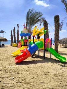 a playground on the beach near the water at Fahd palm beach chalet in Ain Sokhna